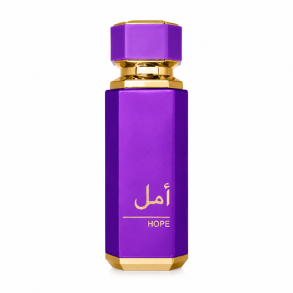 A purple hexagonal perfume bottle with gold trim and gold Arabic lettering that reads 'أمل' above the word 'HOPE', centered on a plain white background.