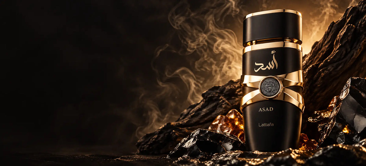 Lattafa Asad on black obsidian with amber smoke, desktop fragrance story